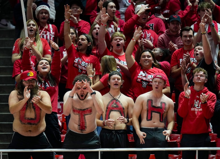 (Bethany Baker  |  The Salt Lake Tribune) Utah Utes fans cheer during the game against the Brigham Young Cougars at the Jon M. Huntsman Center in Salt Lake City on Saturday, Dec. 9, 2023.