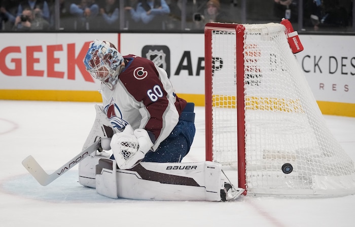 (Bethany Baker  |  The Salt Lake Tribune) The puck flies by the net as Colorado Avalanche goaltender Justus Annunen (60) blocks during the game between the Utah Hockey Club and the Colorado Avalanche at the Delta Center in Salt Lake City on Thursday, Oct. 24, 2024.