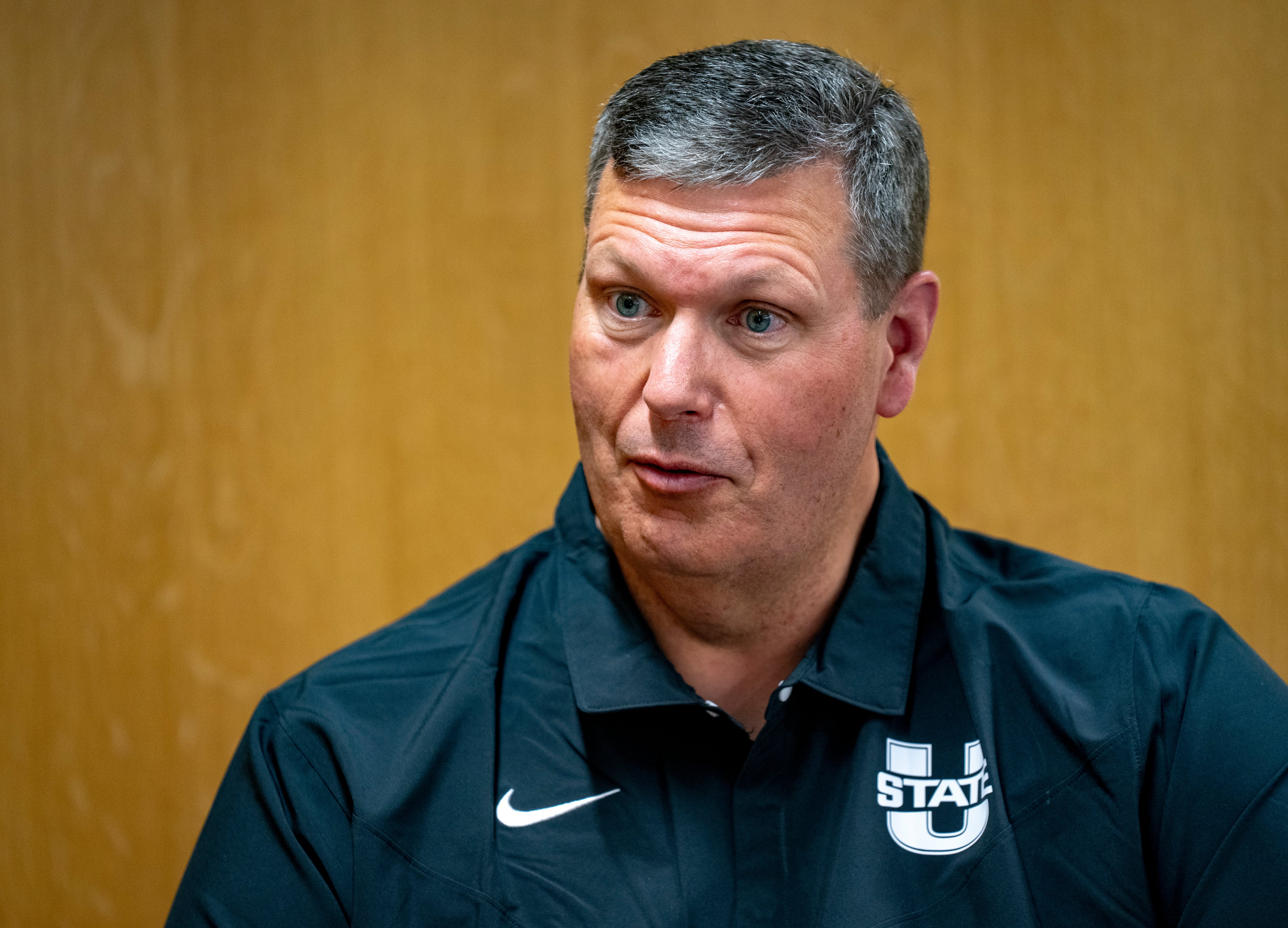 (Rick Egan | The Salt Lake Tribune) Associate head coach,Troy Morrell, is interviewed on media day at the Jim and Carol Laub Athletics-Academics Complex, at Utah State University, on Thursday, Aug. 1, 2024.
