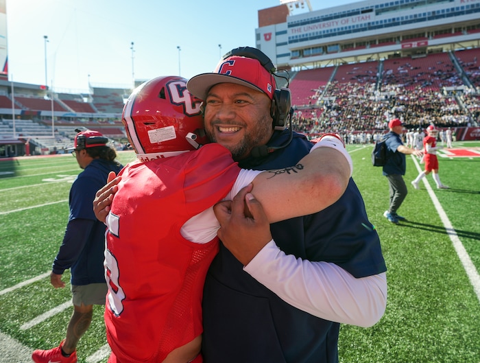 (Chris Samuels | The Salt Lake Tribune) Crimson Cliffs head coach Wayne Alofipo celebrates with players after winning the 4A high school football championship game against Green Canyon at Rice-Eccles Stadium, Friday, Nov. 17, 2023.