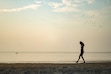 (Rick Egan | The Salt Lake Tribune) Dibora Sahile wades in the Great Salt Lake on Aug. 8, 2024. A lawsuit filed by a coalition of environmental groups raises the question of the state's obligation to protect the Great Salt Lake and its potentially conflicting  responsibility to respect water rights.