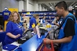 (Bethany Baker  |  The Salt Lake Tribune) Sandi Harding, the general manager of the last Blockbuster store in Oregon, helps a customer in the Blockbuster Experience booth during FanX at the Salt Palace Convention Center in Salt Lake City on Thursday, Sept. 26, 2024.