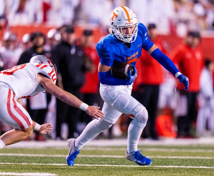 (Rick Egan | The Salt Lake Tribune)   Jackson Farrar (7), runs the ball for Timpview as Evan Dehart defends for Bountiful, in 5A State playoff action between the Timpview Thunderbirds and the Bountiful Redhawks, at Rice-Eccles Stadium, on Friday, Nov. 17, 2023.
