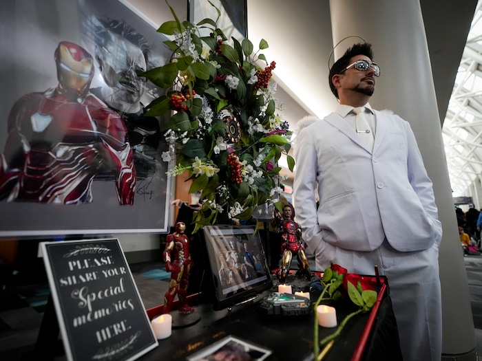 (Bethany Baker | Salt Lake Tribune) Michael Shane stands next to a memorial for Iron Man’s Tony Stark following the character’s death in “Avengers: Endgame” during FanX at Salt Palace Convention Center in Salt Lake City on Friday, Sept. 22, 2023.