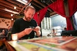 (Bethany Baker  |  The Salt Lake Tribune) Mike Fazziola plays the board game Talisman at Thieves Guild, a new fantasy-themed cidery that opened in October, in Salt Lake City on Friday, Nov. 8, 2024.