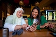 (Trent Nelson | The Salt Lake Tribune) Fatima Rahman shows Lavanya Mahate her TikTok channel at Saffron Valley in Salt Lake City on Tuesday, Oct. 8, 2024.