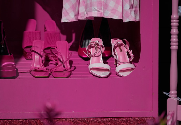 (Bethany Baker  |  The Salt Lake Tribune) Pink shoes sit in a pink wardrobe on the porch of a home in a section of Daybreak that has collectively created a Barbieland-themed community for Halloween on Wednesday, Oct. 11, 2023.