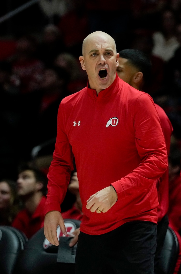 (Bethany Baker  |  The Salt Lake Tribune) Utah Utes head coach Craig Smith reacts to a call in the game against the Brigham Young Cougars at the Jon M. Huntsman Center in Salt Lake City on Saturday, Dec. 9, 2023.