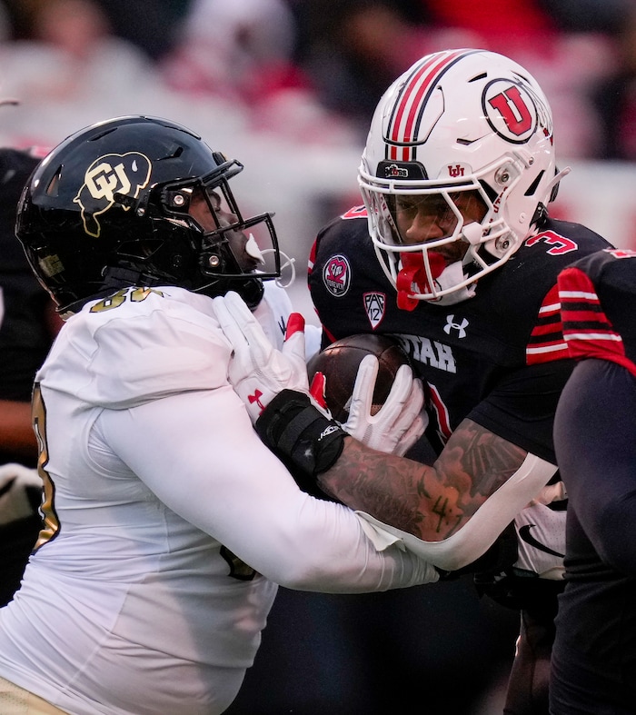 (Bethany Baker  |  The Salt Lake Tribune) Colorado Buffaloes defensive lineman Amari McNeill (88) tackles Utah Utes running back Ja'Quinden Jackson (3) at Rice-Eccles Stadium in Salt Lake City on Saturday, Nov. 25, 2023.