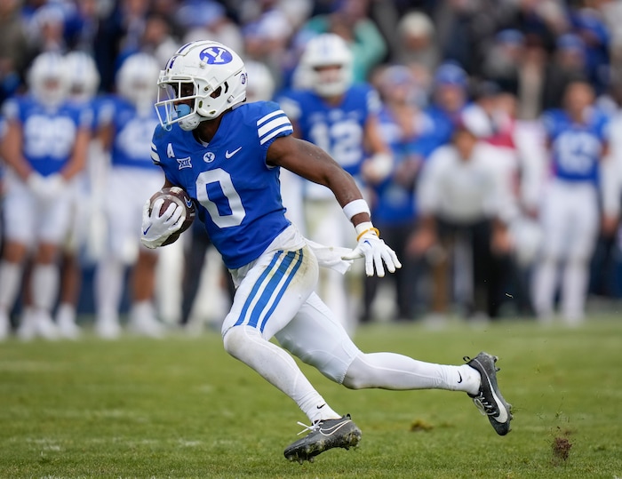 (Bethany Baker  |  The Salt Lake Tribune) Brigham Young Cougars wide receiver Kody Epps (0) runs the ball against the Oklahoma Sooners at LaVell Edwards Stadium in Provo on Saturday, Nov. 18, 2023.