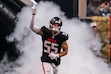 Atlanta Falcons linebacker Kaden Elliss (55) runs out for player introductions before the first half of an NFL football game against the Dallas Cowboys, Sunday, Nov. 3, 2024, in Atlanta. The Falcons defeated the Cowboys 27-21. Elliss played for Salt Lake City's Judge Memorial High School before his collegiate career at Idaho. His brother Jonah is a linebacker for the Denver Broncos.(AP Photo/Danny Karnik)