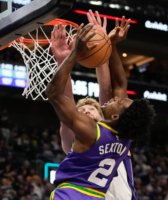 (Francisco Kjolseth  |  The Salt Lake Tribune) Utah Jazz guard Collin Sexton (2) is pressured by Sacramento Kings forward Domantas Sabonis (10) as the Utah Jazz host the Sacramento Kings, during NBA basketball in Salt Lake City on Wednesday, Oct. 25, 2023.