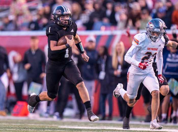 (Rick Egan | The Salt Lake Tribune) Corner Canyon QB Isaac Wilson (1), runs for a touchdown, in the Chargers 6A State championship win over the Skyridge Falcons, at Rice-Eccles Stadium, on Friday, Nov. 17, 2023.