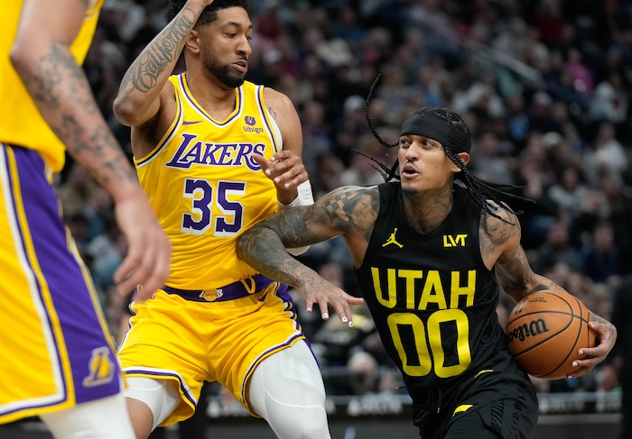 (Francisco Kjolseth  |  The Salt Lake Tribune) Los Angeles Lakers forward Christian Wood (35) defends against Utah Jazz guard Jordan Clarkson (00) during an NBA basketball game Wednesday, Feb. 14, 2024, in Salt Lake City.