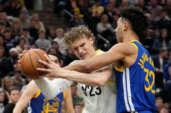 (Francisco Kjolseth  |  The Salt Lake Tribune) Utah Jazz forward Lauri Markkanen (23) tries to muscle the ball past Golden State Warriors forward Draymond Green (23) during an NBA basketball game Thursday, Feb. 15, 2024, in Salt Lake City.