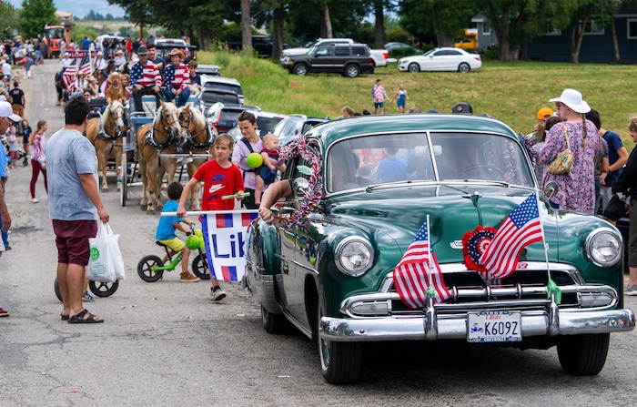 (Rick Egan | The Salt Lake Tribune)  Cars, horses, tractors and bikes join  the Liberty Days Parade in Liberty, Utah, on Tuesday, July 4, 2023.   