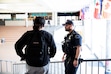 (Rachel Rydalch | The Salt Lake Tribune) Student Resource Officer Tom Poer interacts with a Hunter High School student on Thursday, March 24, 2022. A new Utah law requires armed guards in every public school, but schools are struggling to comply.