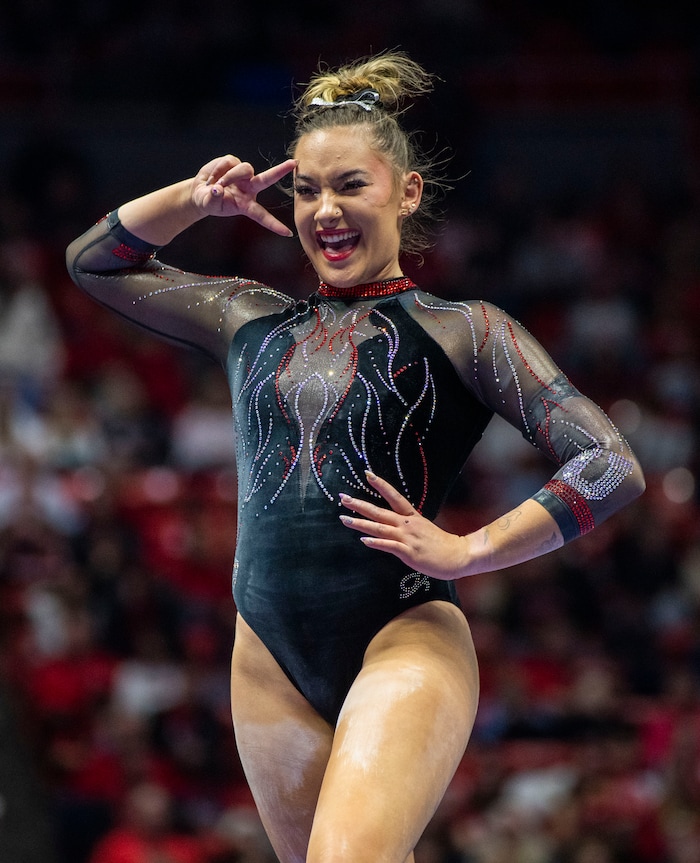 (Rick Egan | The Salt Lake Tribune)  Makenna Smith performs on the beam, in gymnastics action between Utah Red Rocks and Oregon State, at the Jon M. Huntsman Center, on Friday, Feb. 2, 2024.
