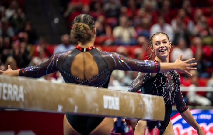 (Rick Egan | The Salt Lake Tribune)  Grace McCallum smiles after landing her dismount on the beam, in gymnastics action between Utah Red Rocks and Oregon State, at the Jon M. Huntsman Center, on Friday, Feb. 2, 2024.
