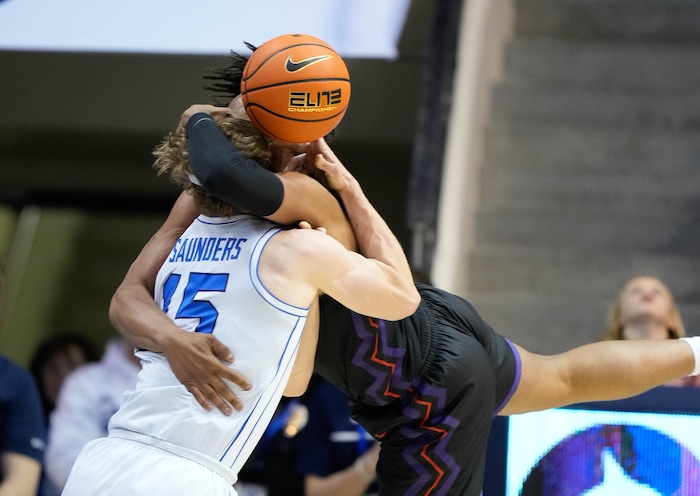 (Francisco Kjolseth  |  The Salt Lake Tribune) Brigham Young Cougars guard Richie Saunders (15) intertwines with TCU Horned Frogs forward Chuck O'Bannon Jr. (5) during an NCAA college basketball game against TCU Saturday, March 2, 2024, in Provo, Utah.