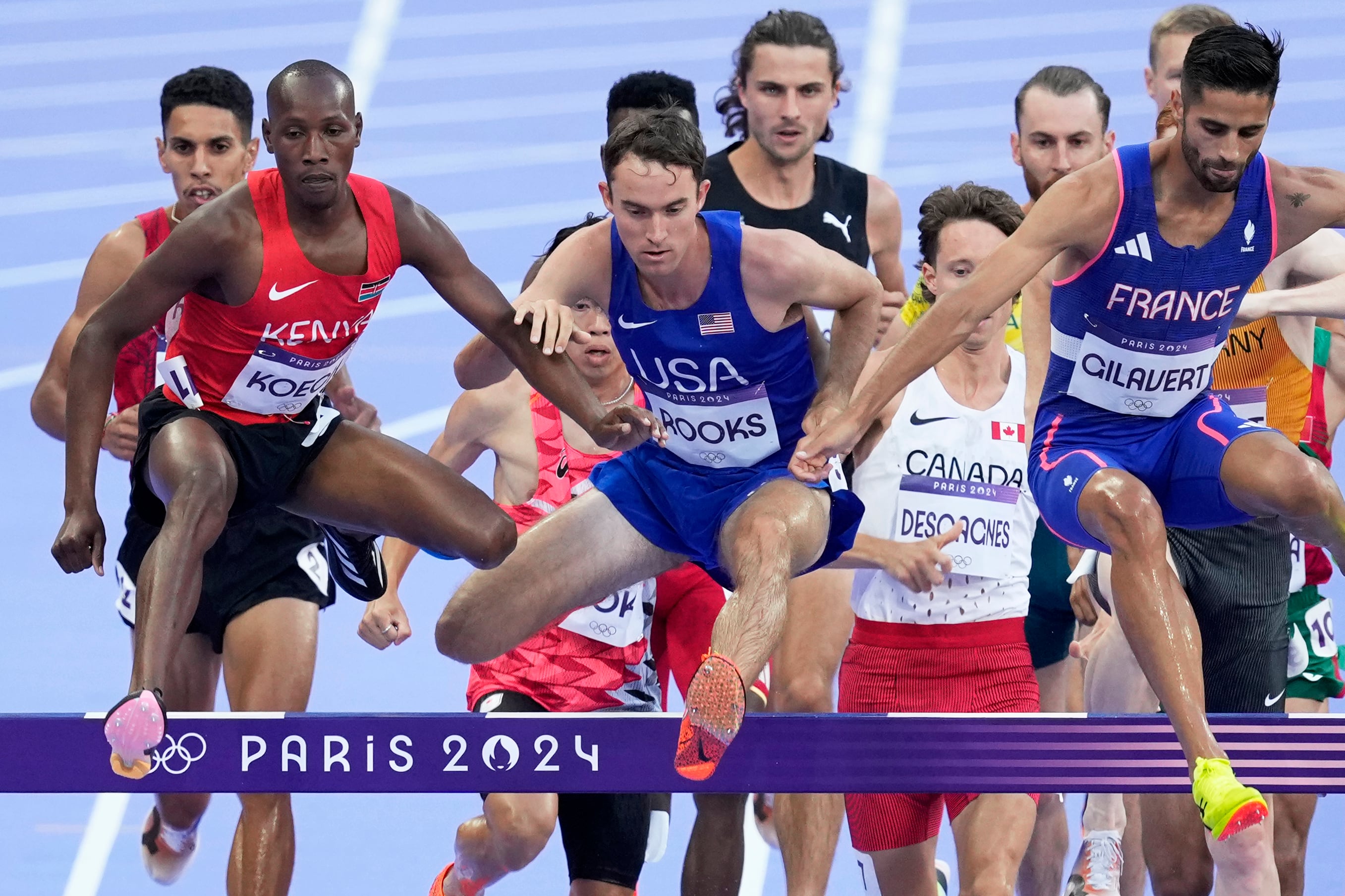 (Martin Meissner | AP) Kenneth Rooks, center, of the United States, competes in a men's 3000 meters steeplechase round 1 heat at the 2024 Summer Olympics, Monday, Aug. 5, 2024, in Saint-Denis, France.