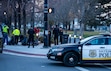 (Rick Egan | The Salt Lake Tribune) Salt Lake City police cars block traffic as officers watch Advantage services collect clothing that was left at Pioneer Park, on Tuesday, Nov. 28, 2023.