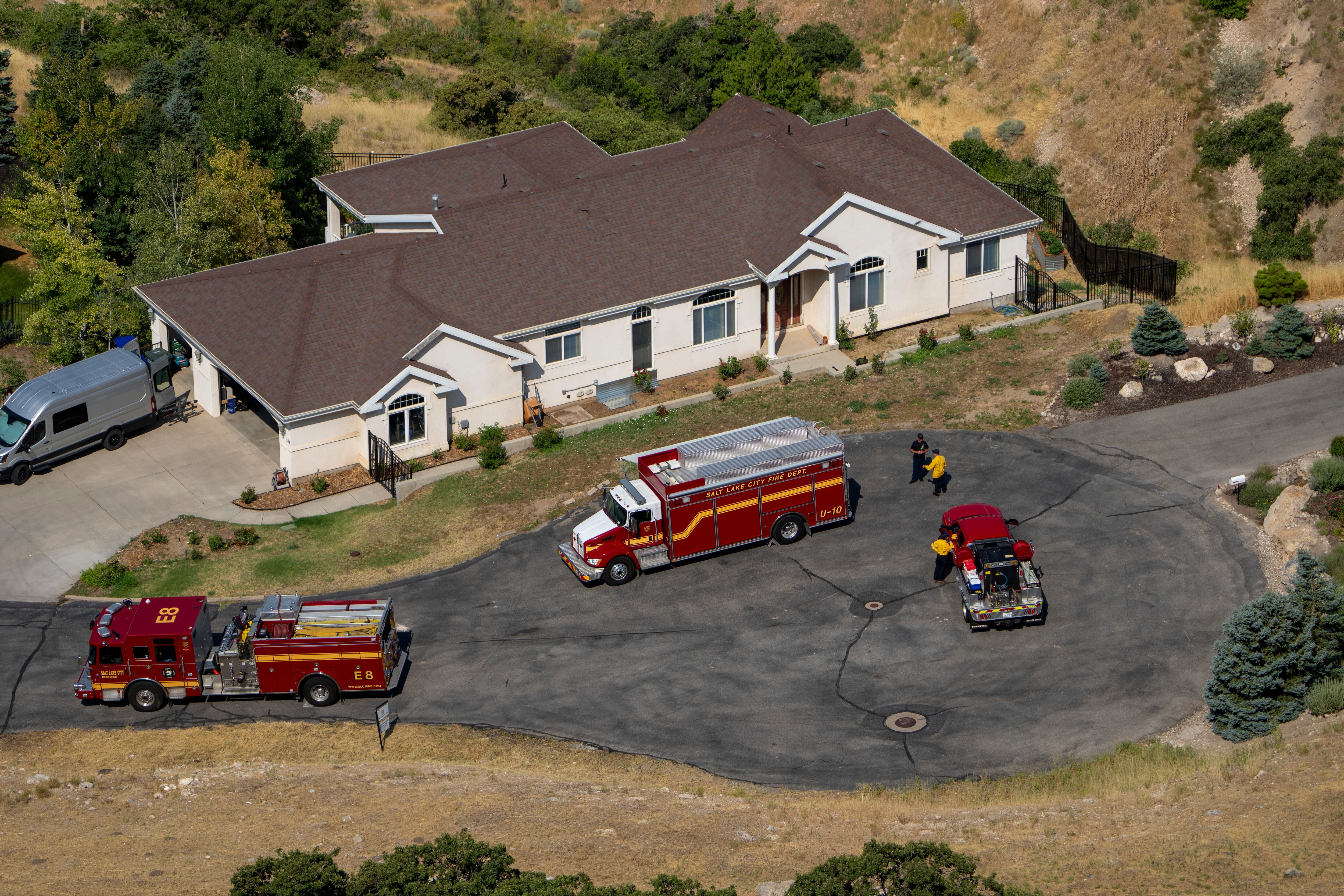 (Rick Egan | The Salt Lake Tribune) Firefighters station on Twickenham Drive as crews battle the Sandhurst fire on Ensign Peak in Salt Lake City on Sunday, July 21, 2024.
