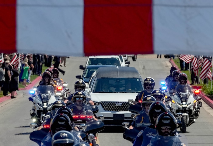 (Francisco Kjolseth  |  The Salt Lake Tribune) The hearse containing the body of Santaquin police Sgt. Bill Hooser following ceremonies at the UCCU Center at Utah Valley University in Orem on Monday, May 13, 2024.