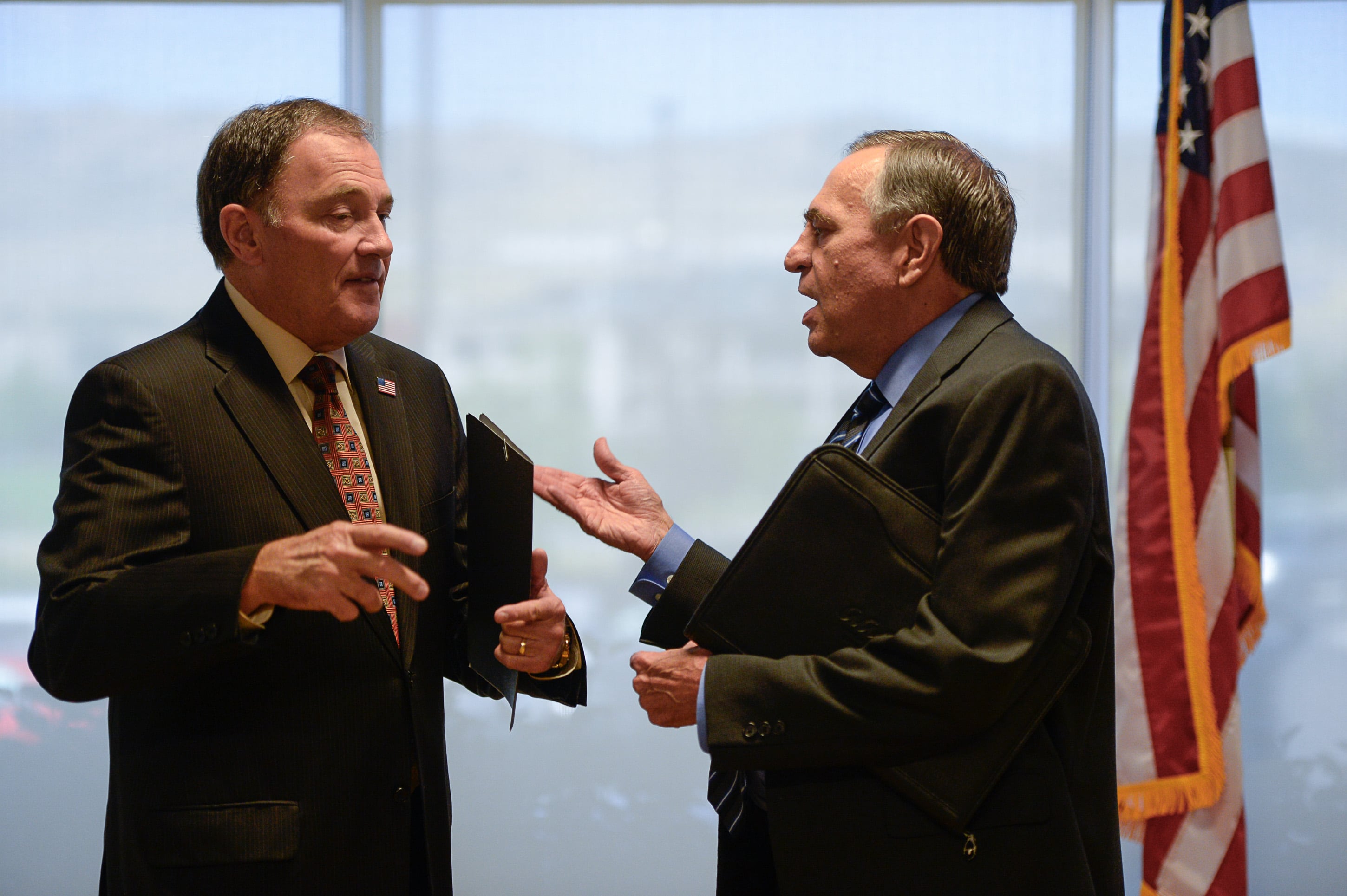 (Francisco Kjolseth | The Salt Lake Tribune) Gov. Gary R. Herbert, speaks with Commissioner of Higher Education Dave Buhler at Silicon Slopes in Lehi following a partnership announcement with IT companies and education to create a pathway program to fill workforce needs in the stateÕs tech industry.