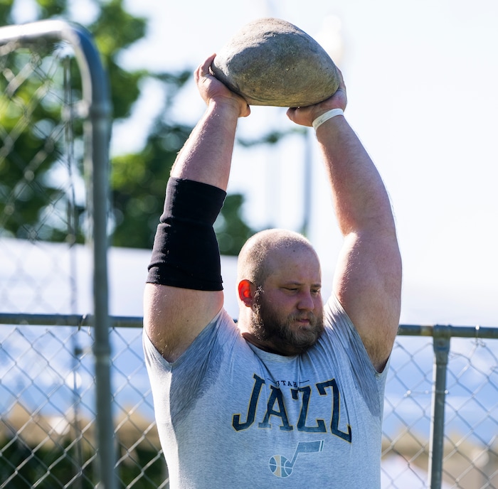 (Rick Egan | The Salt Lake Tribune)  Richard Peterson competes in Stone Throw event in the Utah Stones of Strength Strongman competition at the Utah Scottish Festival, at the Utah State Fairpark, on Friday, June 16, 2023.
