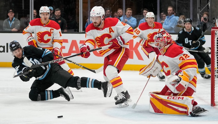 (Francisco Kjolseth  | The Salt Lake Tribune) Utah Hockey Club center Kevin Stenlund (82) tries to score a goal against the Calgary Flames during an NHL hockey game at the Delta Center in Salt Lake City on Wednesday, Oct. 30, 2024.