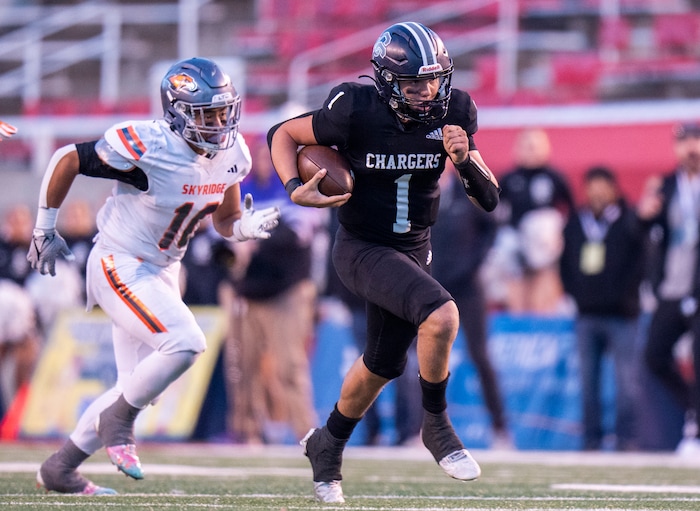 (Rick Egan | The Salt Lake Tribune) Corner Canyon QB Isaac Wilson (1), runs for a touchdown, in the Chargers 6A State championship win over the Skyridge Falcons, at Rice-Eccles Stadium, on Friday, Nov. 17, 2023.