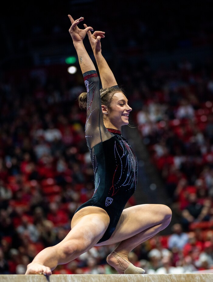 (Rick Egan | The Salt Lake Tribune)  Grace McCallum competes on the beam, in gymnastics action between Utah Red Rocks and Oregon State, at the Jon M. Huntsman Center, on Friday, Feb. 2, 2024.
