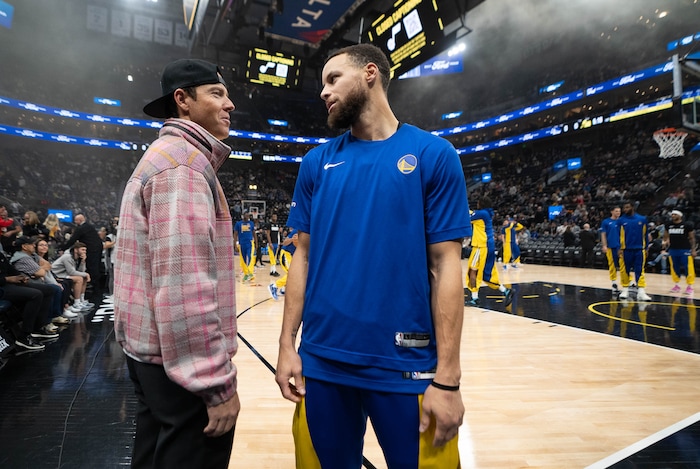 (Francisco Kjolseth  |  The Salt Lake Tribune) Utah Jazz owner Ryan Smith with Golden State Warriors guard Stephen Curry (30) before the start of the game Thursday, Feb. 15, 2024, in Salt Lake City.