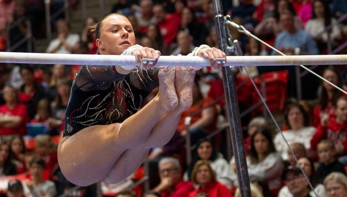 (Rick Egan | The Salt Lake Tribune)  Marie O'Keefe performs on the bars, in gymnastics action between Utah Red Rocks and Oregon State, at the Jon M. Huntsman Center, on Friday, Feb. 2, 2024.
