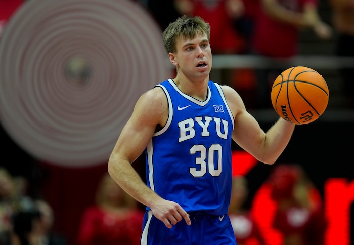 (Bethany Baker  |  The Salt Lake Tribune) Brigham Young Cougars guard Dallin Hall (30) brings the ball down the court at the Jon M. Huntsman Center in Salt Lake City on Saturday, Dec. 9, 2023.