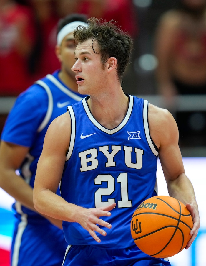 (Bethany Baker  |  The Salt Lake Tribune) Brigham Young Cougars guard Trevin Knell (21) brings the ball down the court at the Jon M. Huntsman Center in Salt Lake City on Saturday, Dec. 9, 2023.