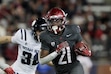 (Young Kwak | AP) Washington State running back Wayshawn Parker (21) carries the ball against Utah State, Saturday, Nov. 9, 2024, in Pullman, Wash. Parker has announced his commitment to the University of Utah.