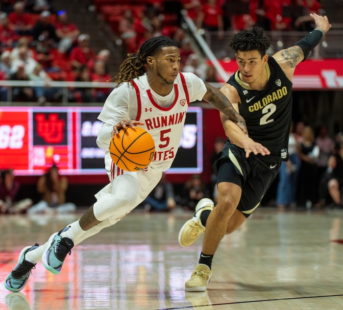 (Rick Egan | The Salt Lake Tribune) Utah Utes guard Deivon Smith (5) gets past Colorado Buffaloes guard KJ Simpson (2), in PAC-12 basketball action between the Utah Utes and the Colorado Buffaloes a the Jon M. Huntsman Center, on Saturday, Feb. 3, 2024.
