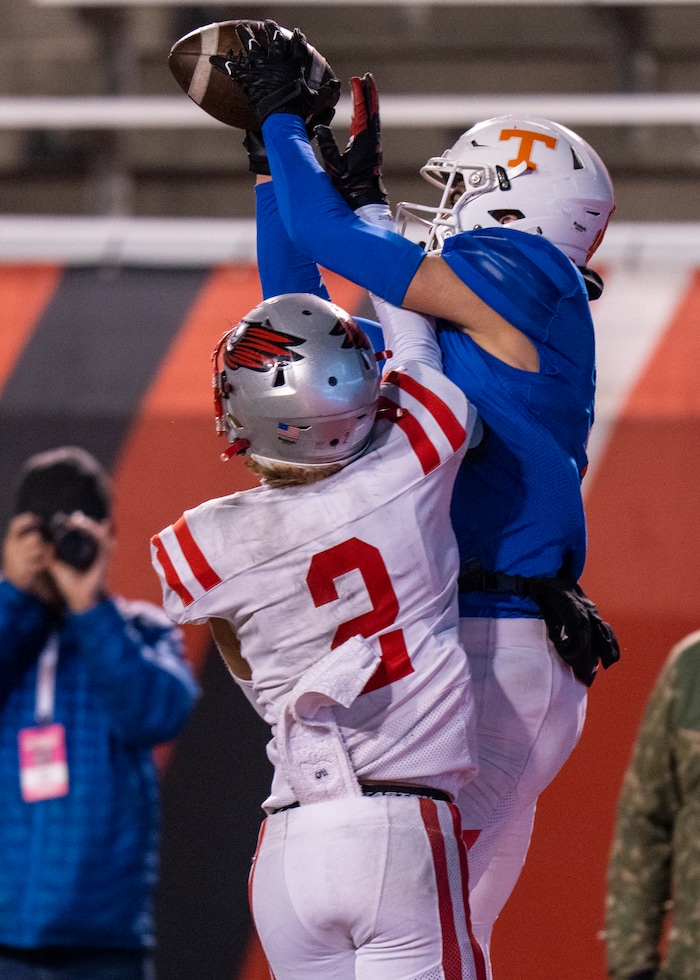 (Rick Egan | The Salt Lake Tribune)   Timpview Thunderbird wide receiver Tei Nacua reaches for a pass, as Brock Mcswain defends for Bountiful, in 5A State playoff action between the Timpview Thunderbirds and the Bountiful Redhawks, at Rice-Eccles Stadium, on Friday, Nov. 17, 2023.
