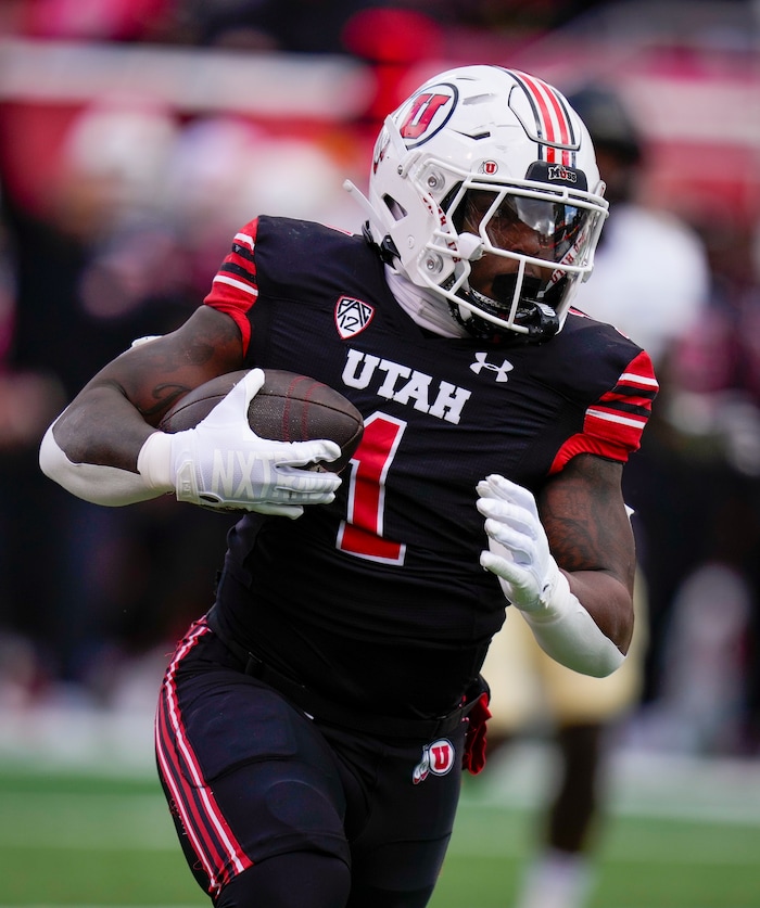 (Bethany Baker  |  The Salt Lake Tribune) Utah Utes running back Jaylon Glover (1) runs the ball against the Colorado Buffaloes at Rice-Eccles Stadium in Salt Lake City on Saturday, Nov. 25, 2023.