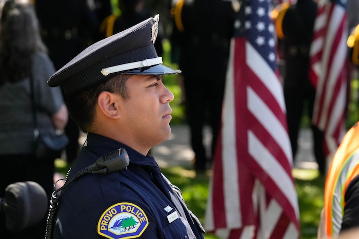 (Francisco Kjolseth  |  The Salt Lake Tribune) Officers stand at attention during funeral services for Santaquin police Sgt. Bill Hooser at the UCCU Center at Utah Valley University on Monday, May 13, 2024.