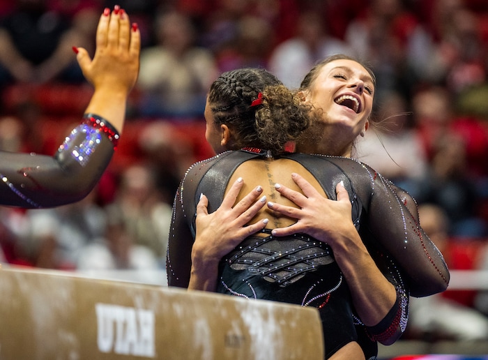 (Rick Egan | The Salt Lake Tribune)  Grace McCallum smiles after landing her dismount on the beam, in gymnastics action between Utah Red Rocks and Oregon State, at the Jon M. Huntsman Center, on Friday, Feb. 2, 2024.
