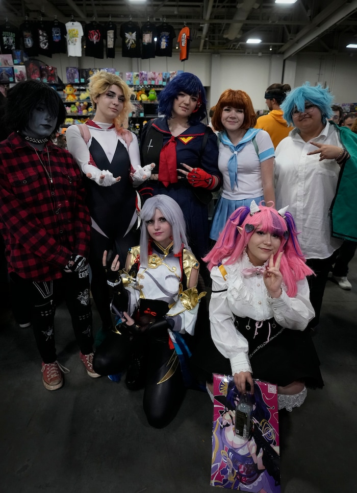 (Bethany Baker | Salt Lake Tribune) A group of friends that met through the Utah cosplay community pose for a photo in Vendor Hall during FanX at Salt Palace Convention Center in Salt Lake City on Friday, Sept. 22, 2023.