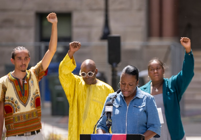 (Rick Egan | The Salt Lake Tribune)  State Rep. Sandra Hollins reads a Juneteenth resolution at City Hall during a flag-raising ceremony Monday, June 19, 2023.
