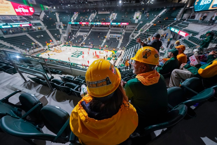 Spectators take their seats prior to the first event at Foster Pavilion, an NCAA college basketball game between Baylor and Cornell, Tuesday, Jan. 2, 2024, in Waco, Texas. (AP Photo/Julio Cortez)