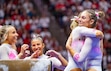 (Rick Egan | The Salt Lake Tribune)  Grace McCallum gets a hug after scoring a 9.900 on the beam for Utah, in Gymnastics action between Utah and Utah State, at the Jon M. Huntsman Center, on Friday, Jan 3, 2025.

