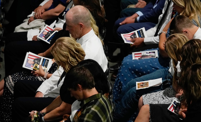 (Francisco Kjolseth  |  The Salt Lake Tribune) Law enforcement and family attend funeral services for Santaquin police Sgt. Bill Hooser at the UCCU Center at Utah Valley University on Monday, May 13, 2024.