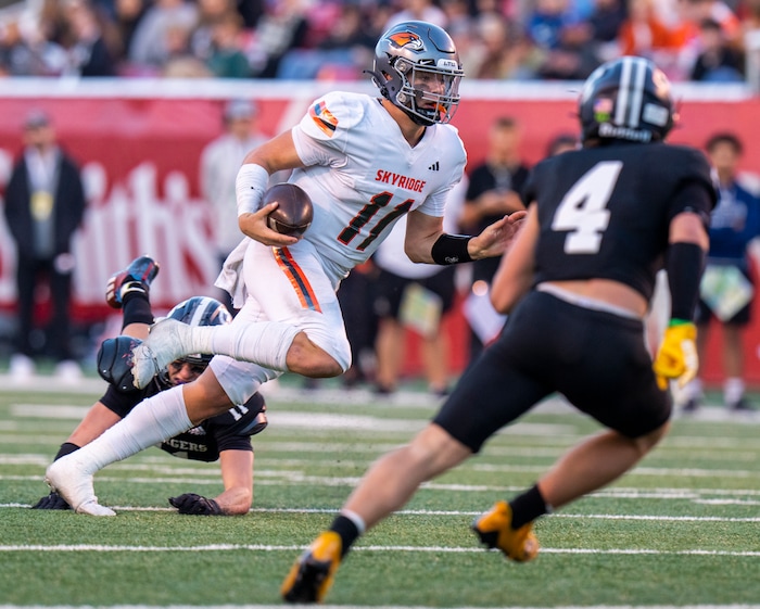 (Rick Egan | The Salt Lake Tribune)   Skyridge QB Jackson Stevens runs the ball, in 6A State playoff action between the Corner Canyon Chargers and the Skyridge Falcons, at Rice-Eccles Stadium, on Friday, Nov. 17, 2023.