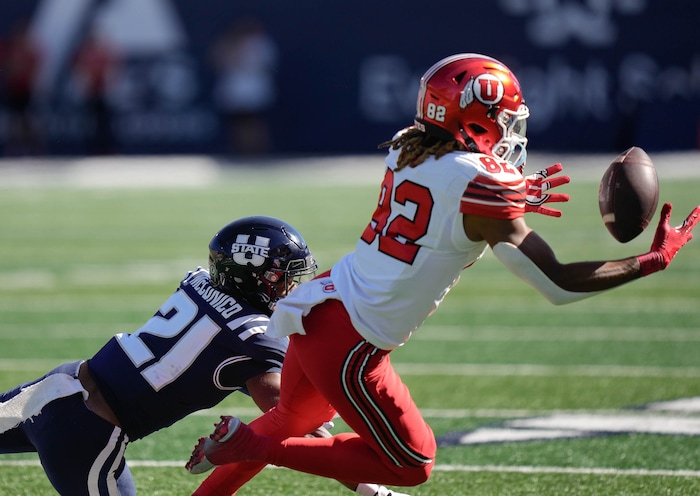 (Francisco Kjolseth  | The Salt Lake Tribune) Utah State Aggies safety Malik McConico (21) breaks up a pass intended for Utah Utes tight end Landen King (82) as Utah State hosts the University of Utah during the first half of an NCAA college football game Saturday, Sept. 14, 2024, in Logan, Utah.